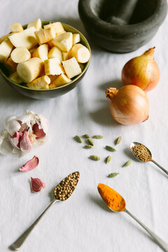 Coriander seeds, turmeric and other spices and vegetables.