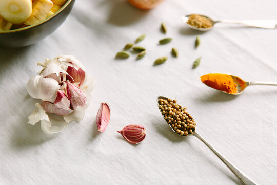 Coriander seeds, turmeric and other spices and vegetables.