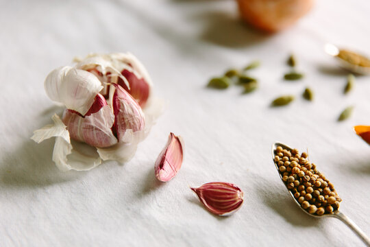 Coriander seeds, turmeric and other spices and vegetables.