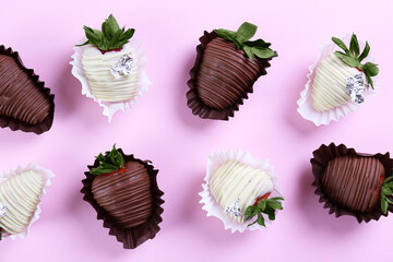 Assorted chocolate covered strawberries as a romantic gesture. Classy sweet desert, berries glazed in dark, and white chocolate. Close up, copy space, top view, isolated background.