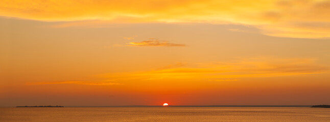 Sunset. Red sky and ocean, beautiful orange landscape panorama skyline background
