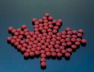 pills filling maple leaf as in Canadian flag