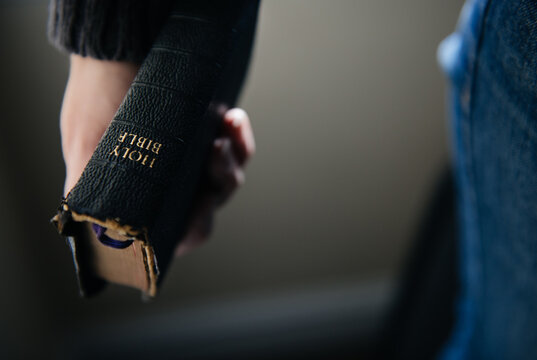 Woman holding bible