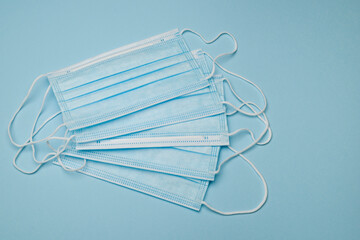Surgical protective face mask on blue background