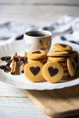 Close up of freshly baked cookies and coffee with use of selective focus.
