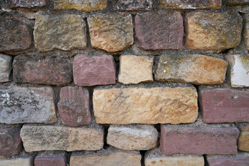 Hintergrund Steinmauer Natursteinmauer aus roten Steinen