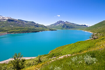 Fototapeta premium Summer view of the artificial Mont Cenis Lake, in the Savoy department near the italian border, in a clear blue sky morning