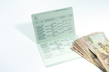 Obraz premium money and passbook on white isolated background