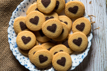 View from top of heart shaped cookies on a plate with use of selective focus.