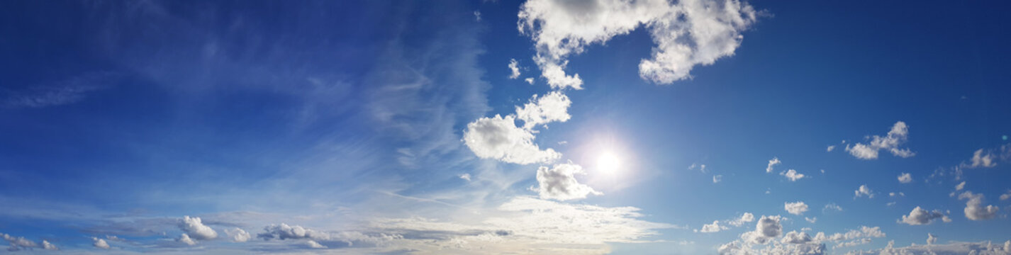 Beautiful panoramic sky with white clouds and sun light