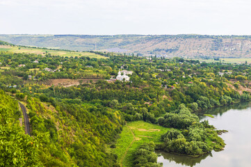 Moldavian village near the railway surrounded by forests on the banks of the Dniester River.