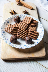 Close up of chocolate cookies in a plate, an ideal food for Christmas celebrations