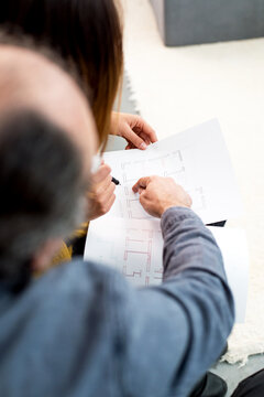 Two people looking into papers