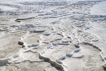 Panoramic view onto travertine terraces of Pamukkale, Turkey. Some of them left without water like these. It's done specially for their formation & save. All these surreal objects included in UNESCO