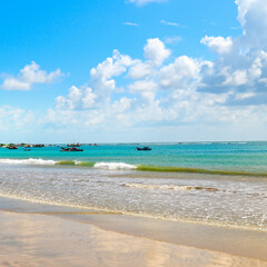 Beautiful seascape with wide sandy beach and clear blue water. The concept of tourism .