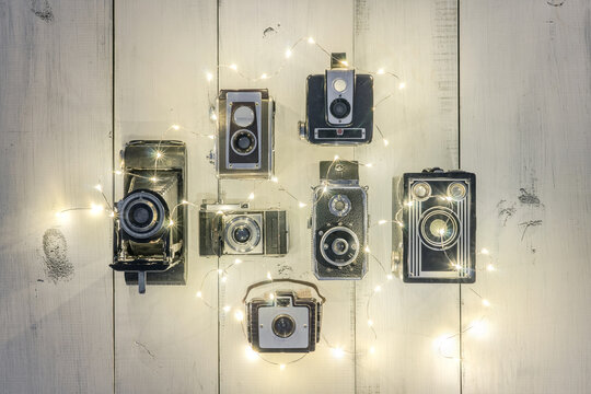 Collection of Antique Cameras and Festive Holiday Lights