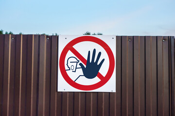International warning sign 'No unauthorized entry'. The sign prohibits the passage of unauthorized...