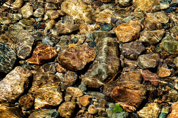 Clear water in the river and stone texture