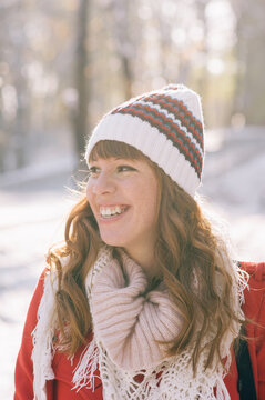 Portrait of a beautiful smiling girl with winter hat