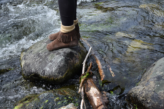 Girl Stands in Stream