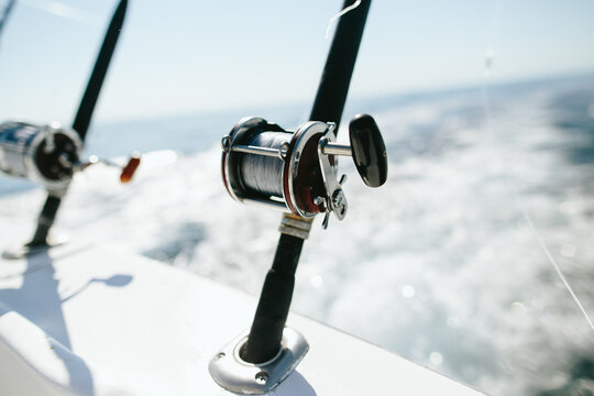 Fishing Rods And Spools Trolling From Back Of Boat