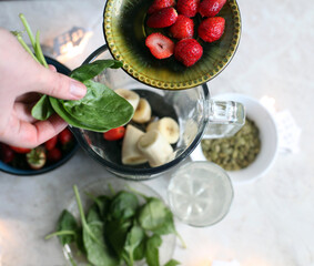 ingridients for banana and strawberry smoothie in blender
