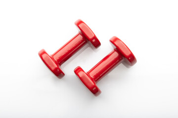 Close up of Red Dumbbells on White Background