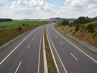 Fototapeta premium 6 September 2020. Heiligenhaus / NRW / Germany. German A44 motorway from Velbert towards Heiligenhaus. The city of Heiiligenhaus is visible in the background