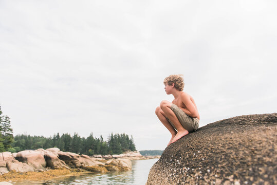 Boy on Rocks at Ocean on Deer Isle, Maine