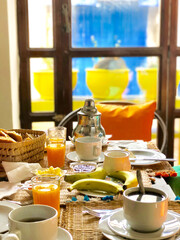 Fototapeta na wymiar Delicious breakfast with mint tea in Moroccan style served in riad