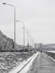 Empty winter embankment in Saint Petersburg with a view of the Neva river