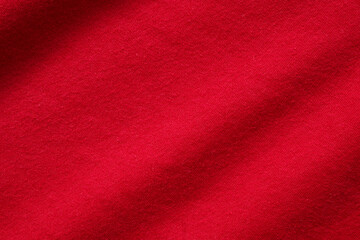 Red fabric cloth texture background close up