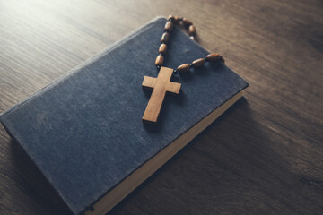 wooden cross on the Bible