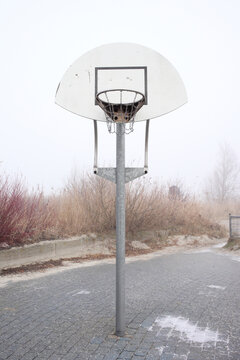 Basketball pole on a foggy day