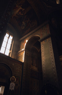Windows illuminates interior full of fresco in old monastery from Byzantine period.