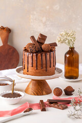 Chocolate cake, truflles on top, and chocolate bars.