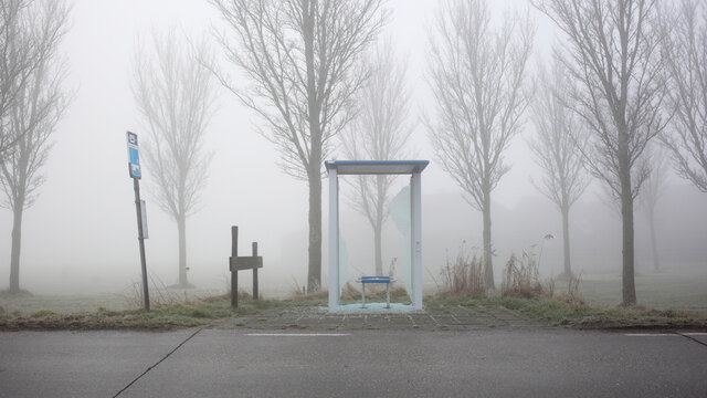 Rural busstop with smashed glass wall
