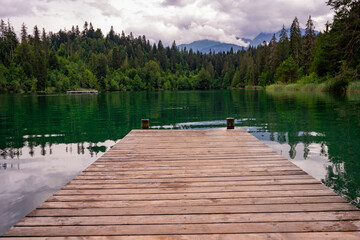 Fototapeta na wymiar wooden pier in lake in Switzerland