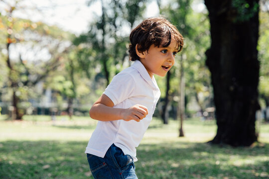 Young Egyptian Boy Runs Around a Park