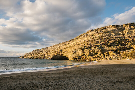 big rock on the beach - caves of matala - at sunset, crete, gree