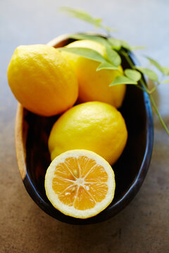 Still life of fresh meyer lemons in bowl