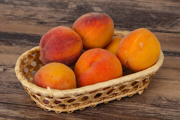 Peach heap in the wooden basket