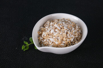 Raw oats in the bowl
