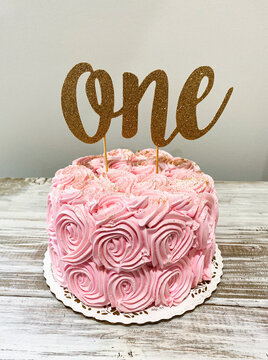 Pink smash cake for one year old birthday party