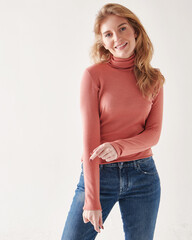Fototapeta premium Young beautiful fashionable model posing in casual clothes in the studio.
