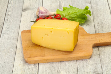 Hard yellow tasty cheese brick