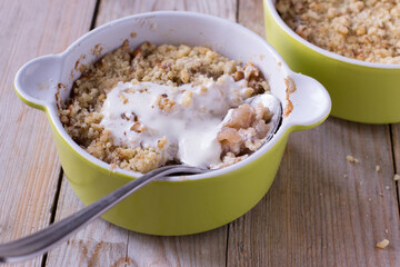 Apple crumble on wooden table