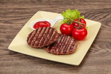 Grilled burger cutlet with sauce