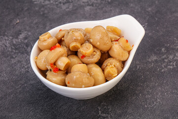 Pickled champignons in the bowl
