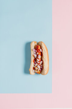 Loaded Hot Dog on Blue and Pink Backgound
